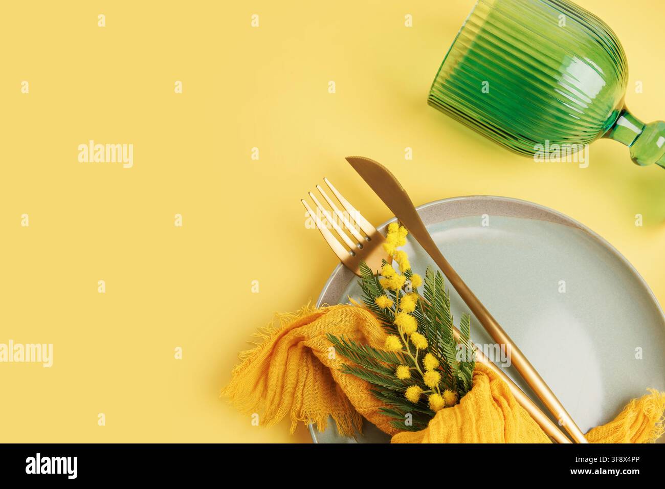 Romantic spring table setting with mimosa for wedding or Valentine concept Stock Photo
