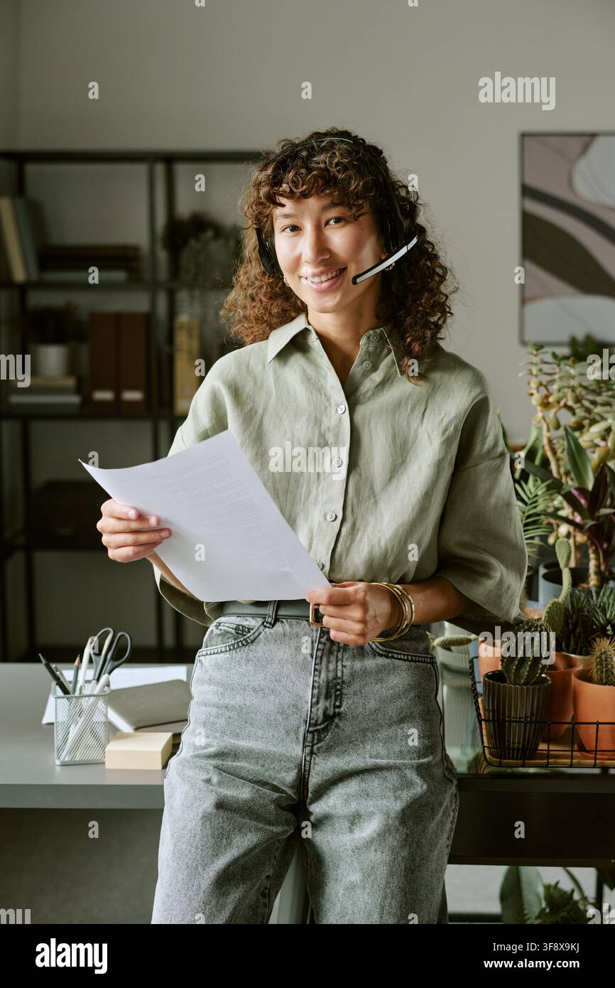 Portrait of Biracial Woman Working in Customer Support Call Center Stock Photo