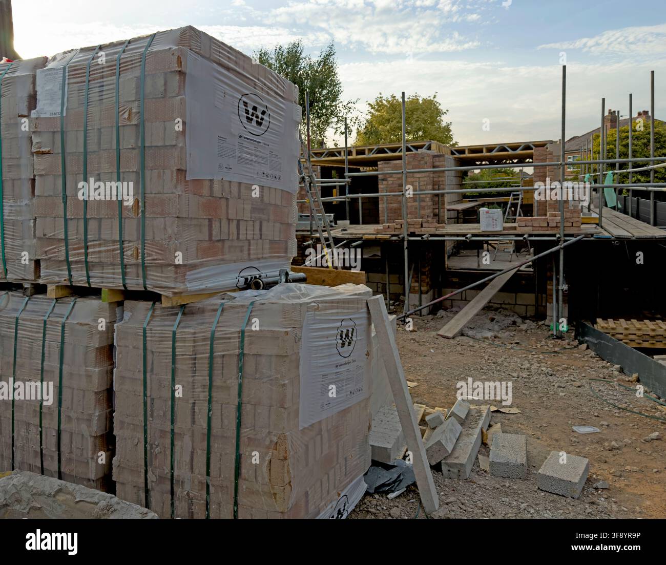 As Labour promise boost, New-build housing construction site with blockwork, scaffolding and building materials in Cheshire, England, UK. Stock Photo
