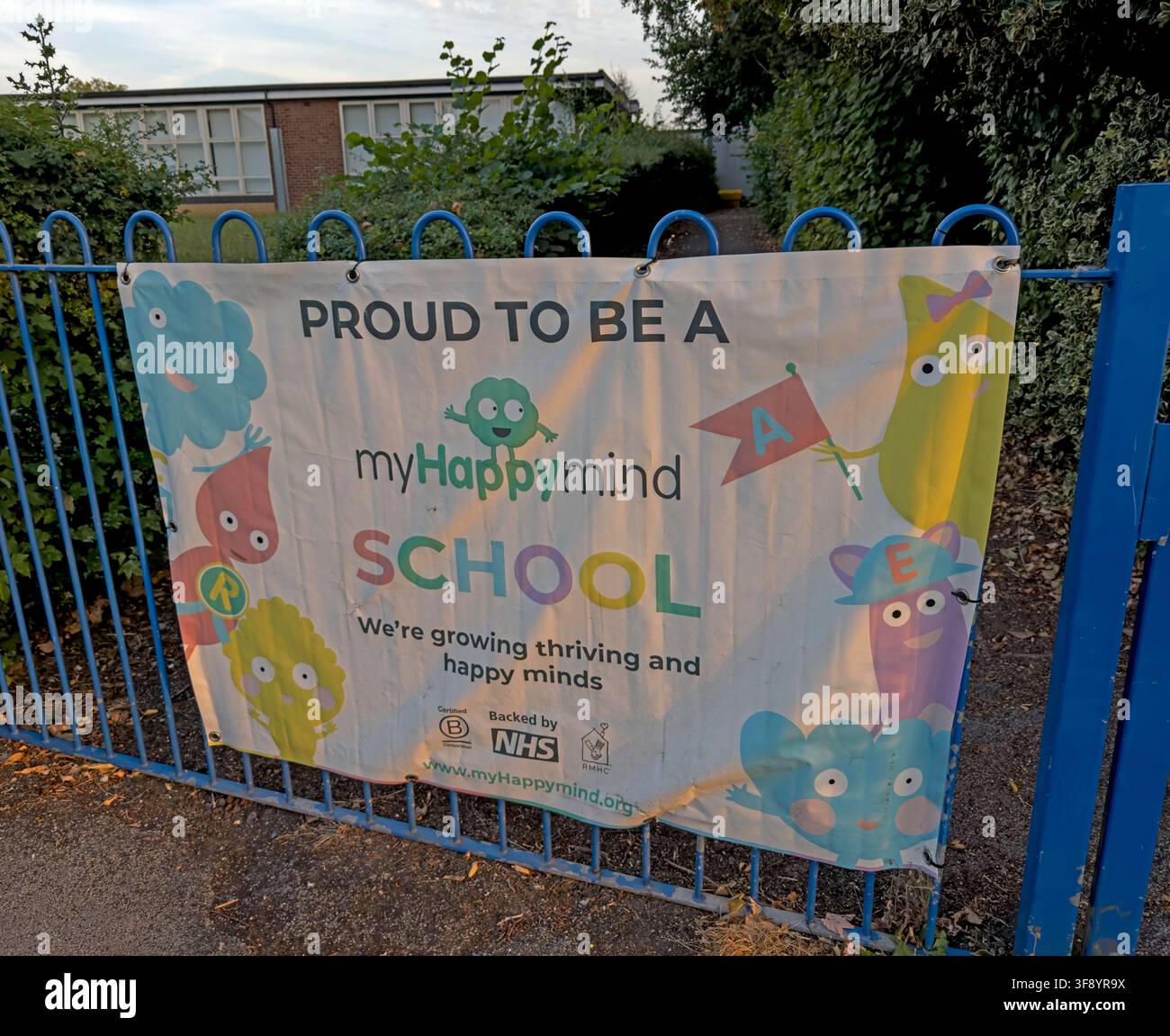 MyHappyMind school wellbeing banner on railings at a primary school in Thelwall, Warrington, Cheshire, England, UK. Stock Photo