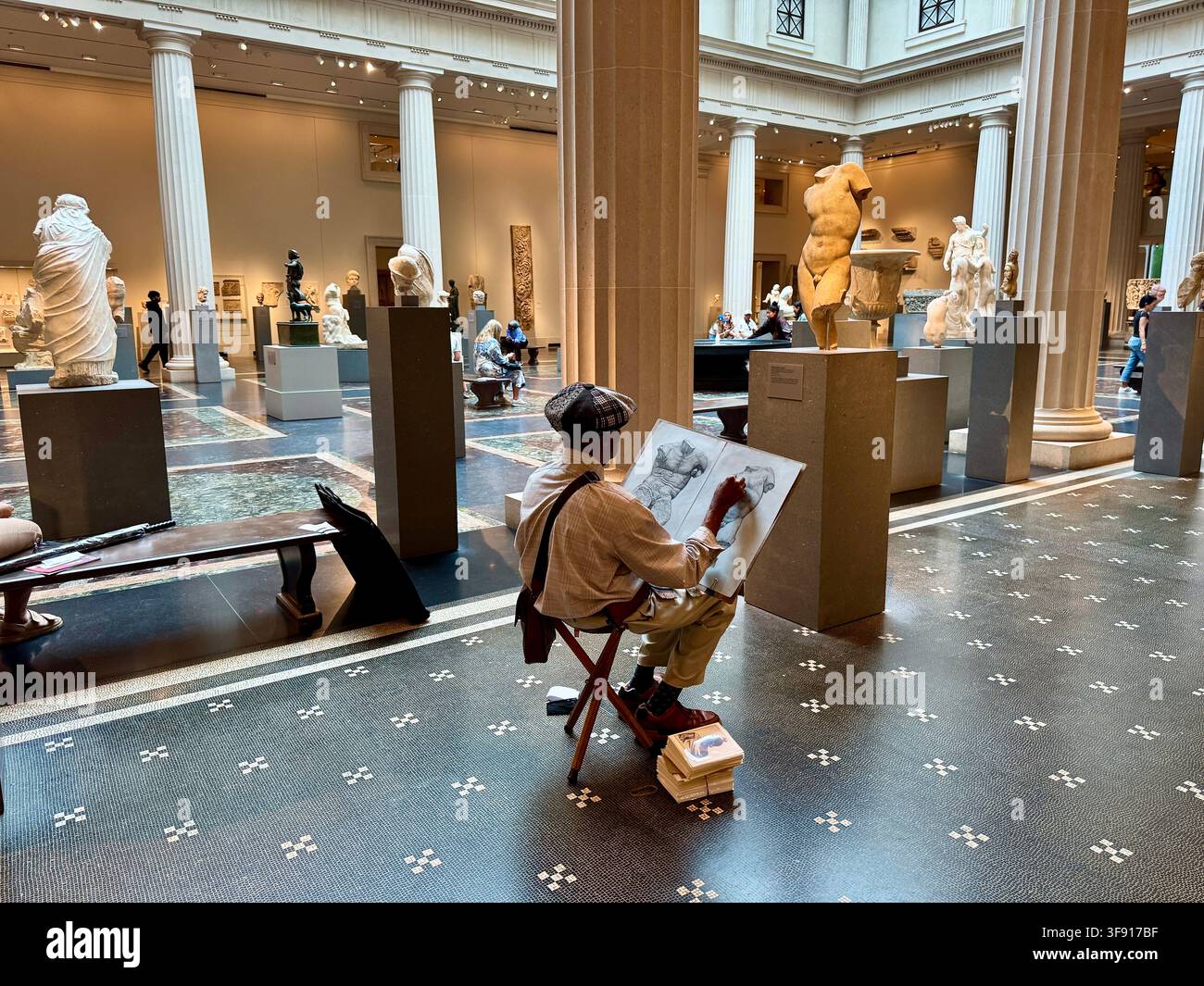 Older Gentleman Sketching in the Greek and Roman Gallery of the Metropolitan Museum of Art in New York City - Smartphone Captured Stock Image