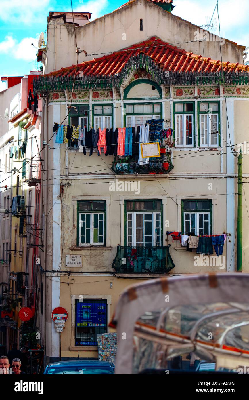 Colorful laundry drying on an old Lisbon apartment building Stock Photo