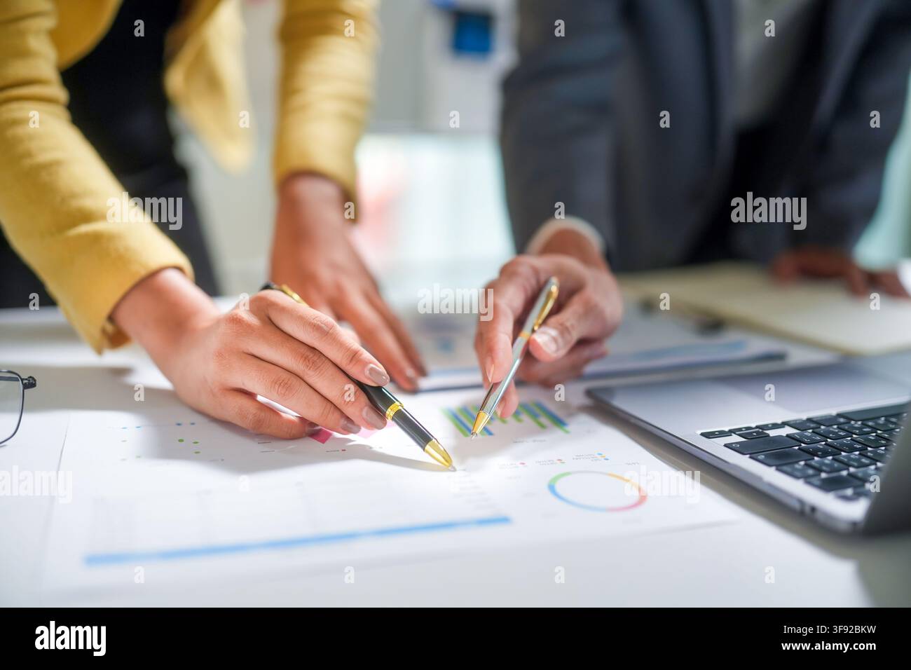 Business Team Analyzing Financial Charts Stock Photo