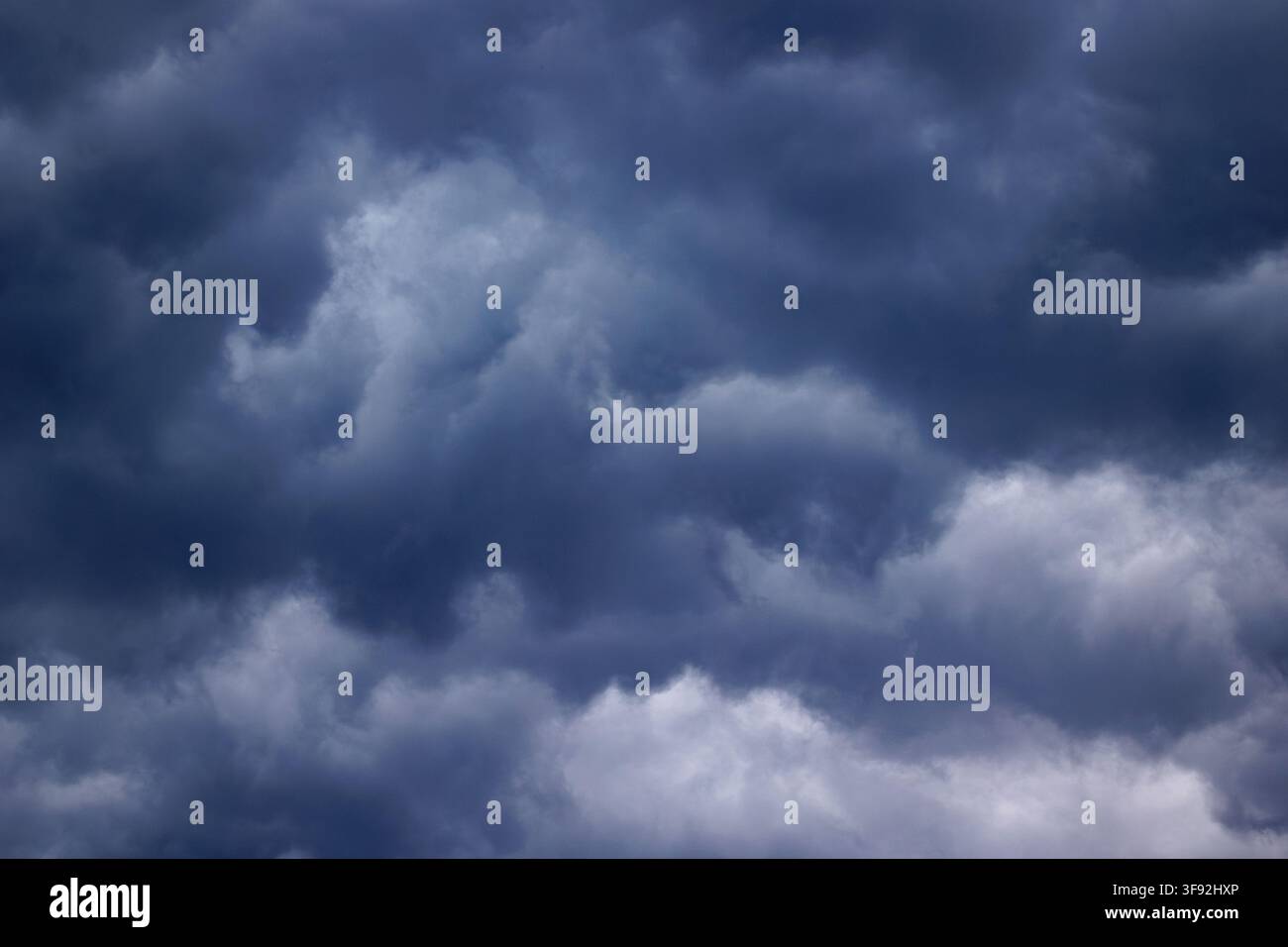 Dark stormy clouds covering the sky before rain Stock Photo