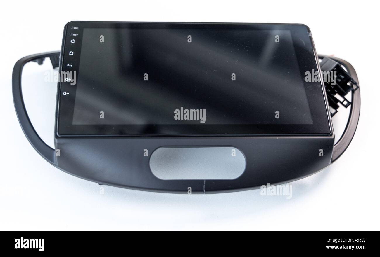 Black car multimedia touchscreen head unit with plastic bezel on white Stock Photo