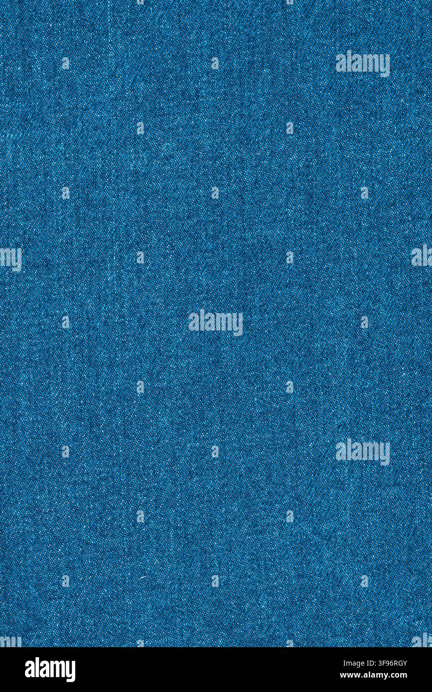 Blue denim fabric texture surface. Close up of woven jeans material. Natural cotton cloth background for fashion design, textile pattern, garment indu Stock Photo