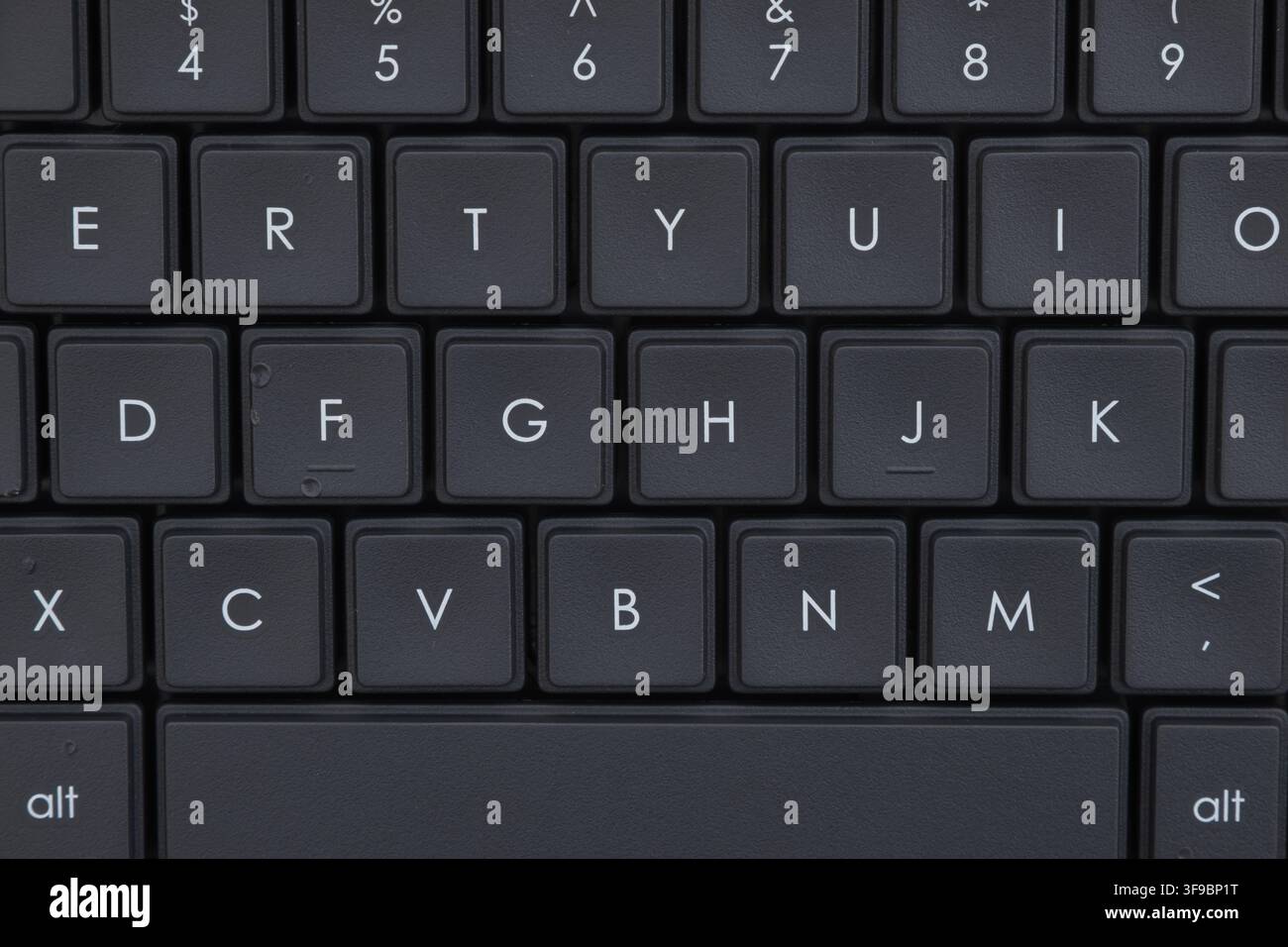 Close-up of black computer keyboard background for technology, communication, and digital workspace Stock Photo