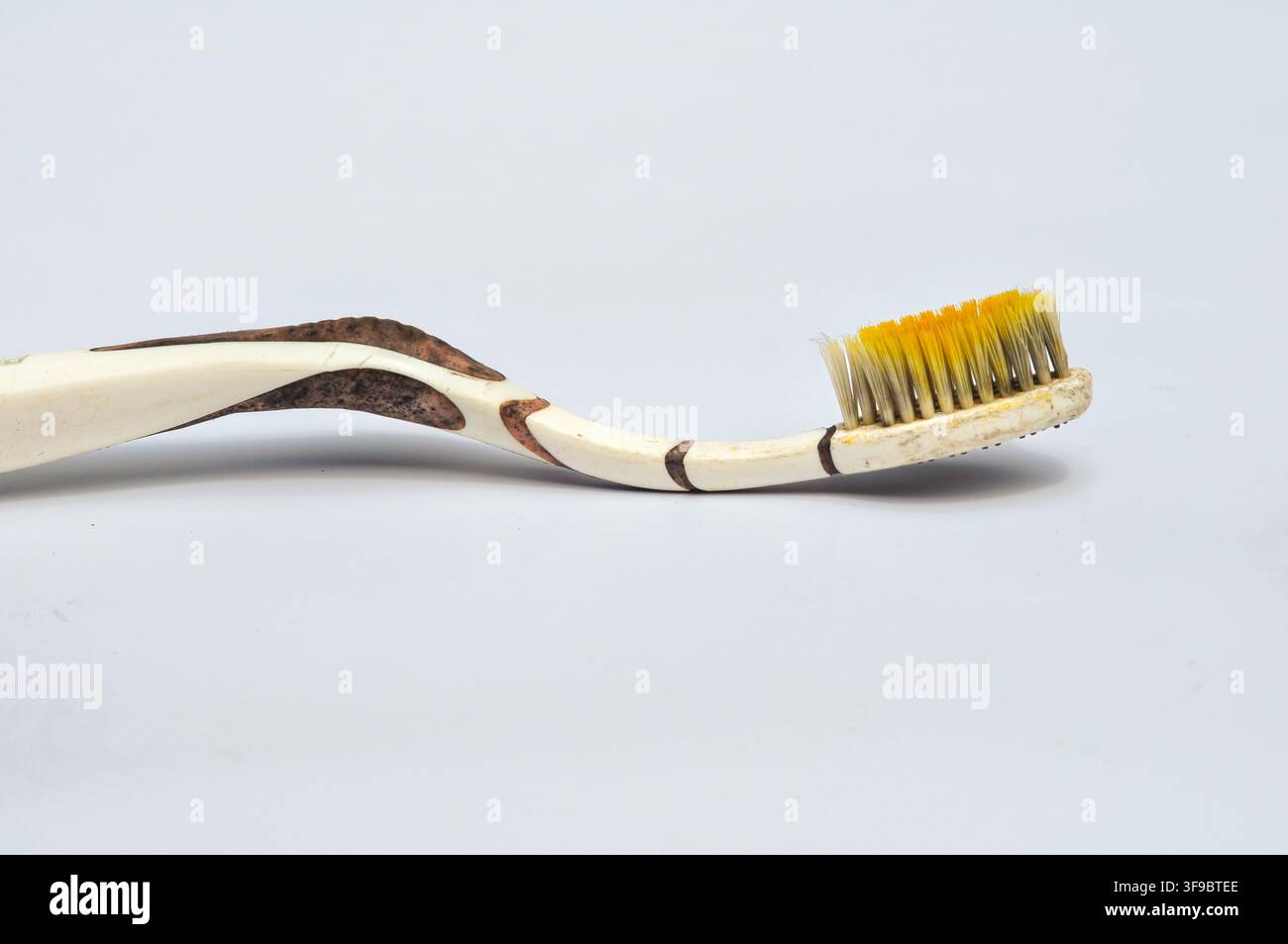 Old Worn Toothbrush on White Background Stock Photo