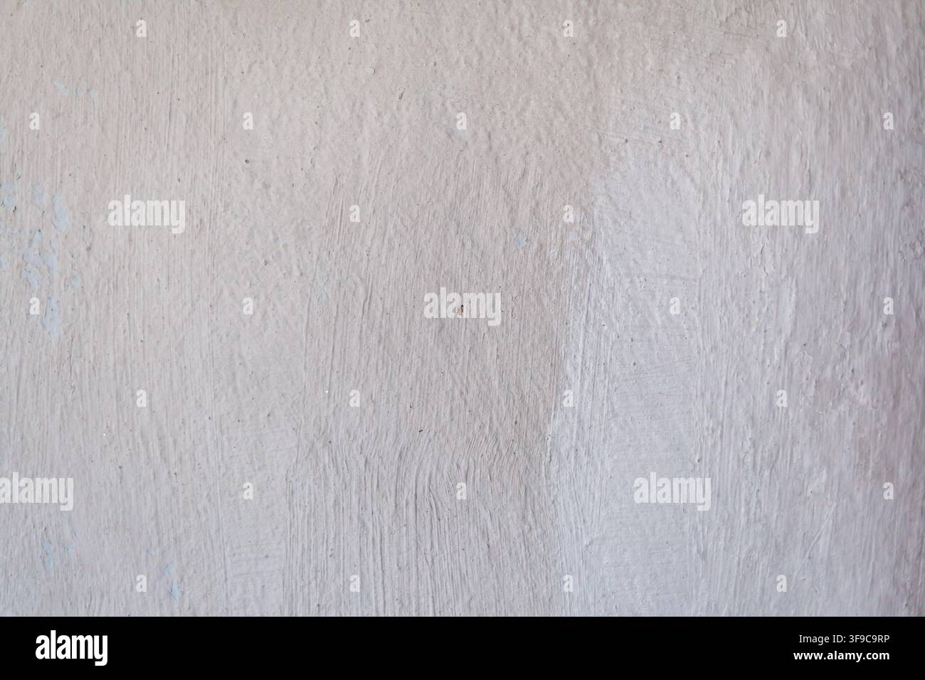 Textured white wall surface with subtle variations and imperfections, suitable for backgrounds or design elements in various projects Stock Photo