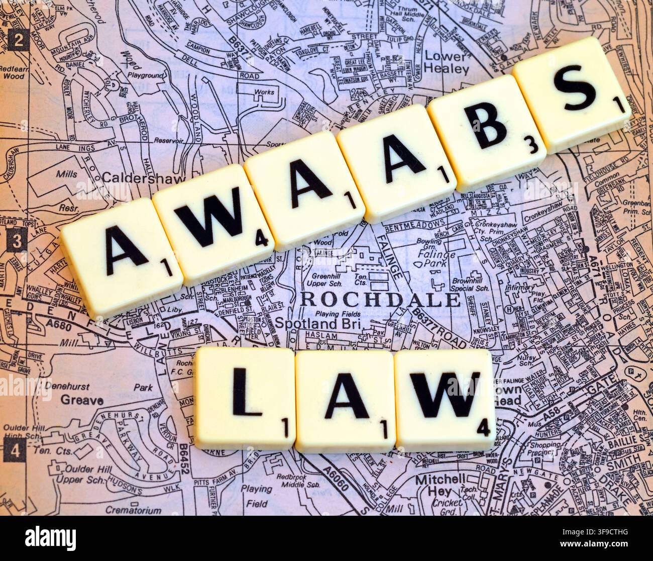 Awaab's Law letter tiles over a Rochdale map,illustrating social housing safety, damp and mould, tenants' rights and landlord accountability, Oct 2026 Stock Photo