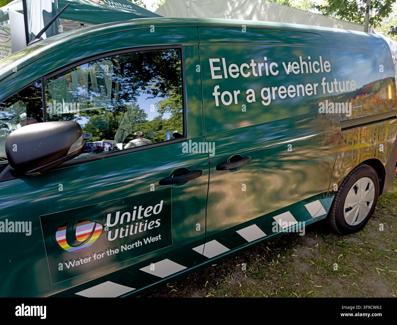 United Utilities electric service van promoting a greener future. Stock Photo