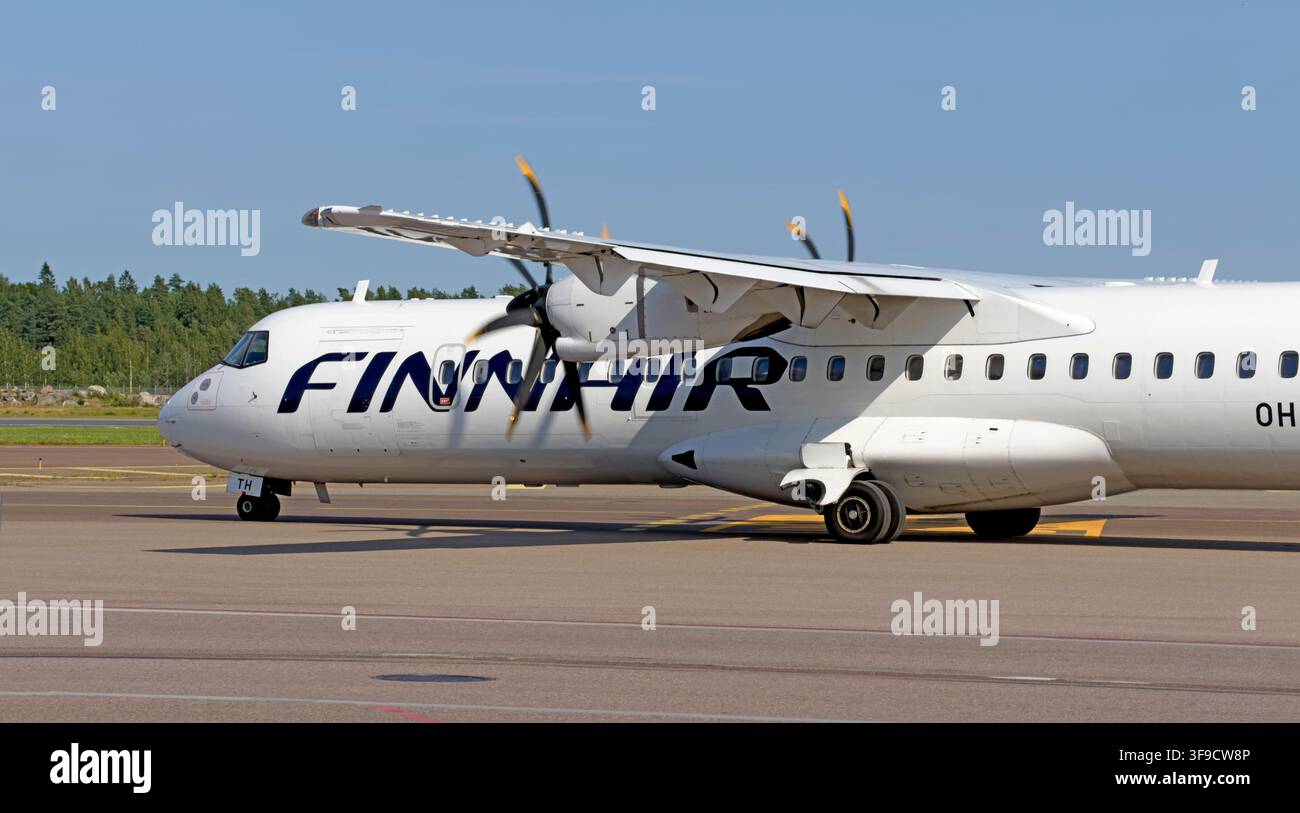 Finnair ATR 72-500 regional turboprop aircraft on the apron at Helsinki Airport, Finland, operating a propeller service to Tallinn, Estonia. Stock Photo