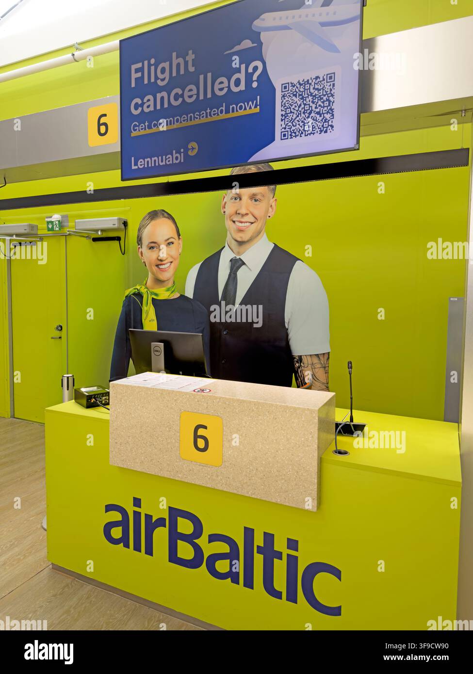 Air Baltic desk Tallinn Airport - Lennuabi Advert at gate 6. Stock Photo