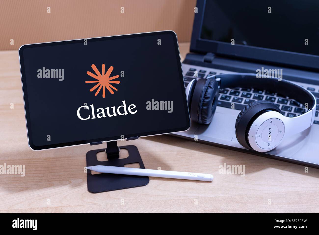 Claude logo on an Apple iPad screen. Stock Photo