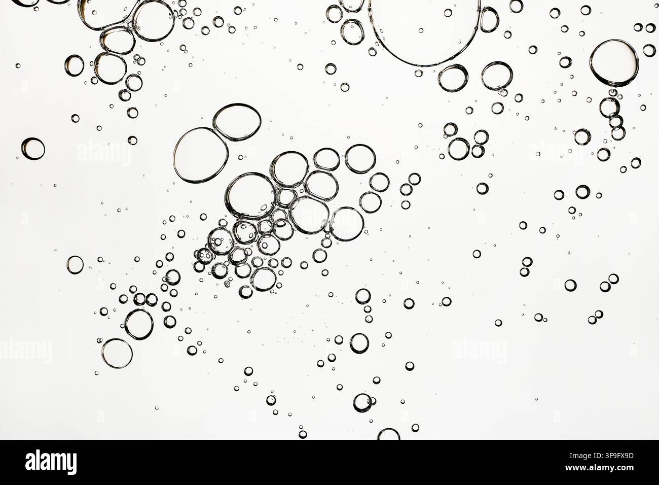 Abstract bubbles in liquid on white background Stock Photo