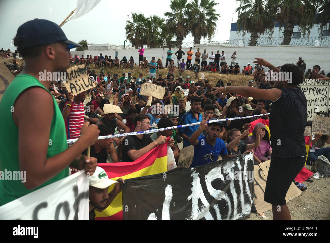 16 August 2026, Spain, Ceuta: Migrants are demonstrating on Playa Del ...