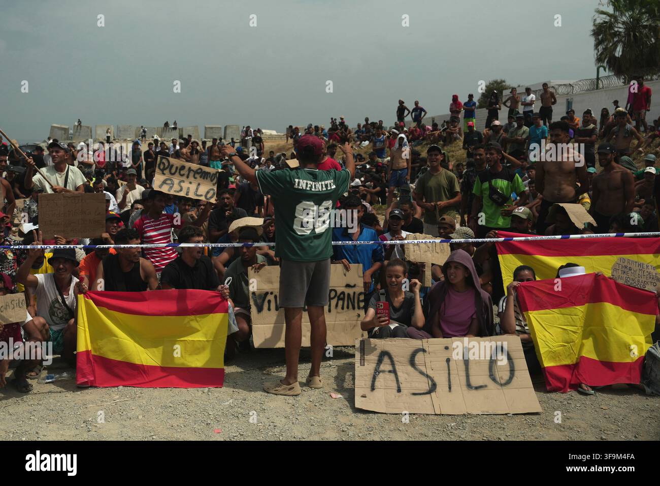 16 August 2026, Spain, Ceuta: Migrants are demonstrating on Playa Del ...