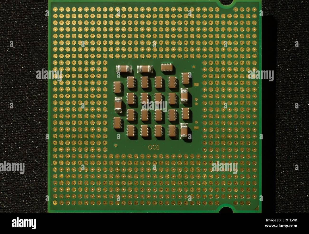 Central processing unit processor chip. Computer hardware component with gold pins and electronic circuits. Technology and digital computing concept. Stock Photo
