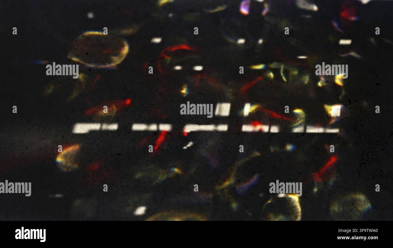 Abstract Light Refractions on Dark Surface Creating Colorful Patterns Stock Photo