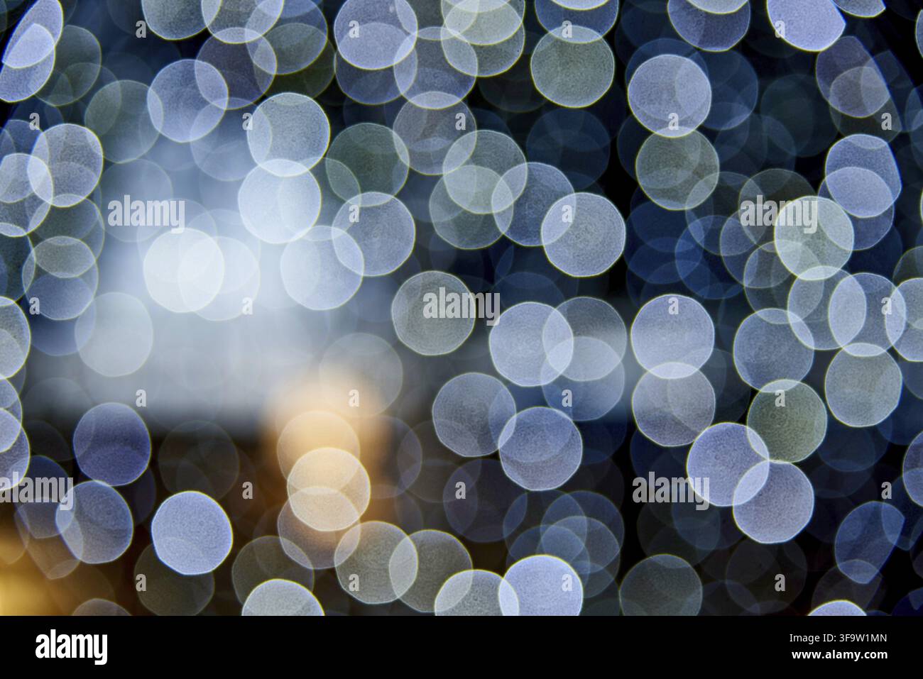 Bokeh abstract texture. Defocused background. Blurred bright light. Circular points Stock Photo