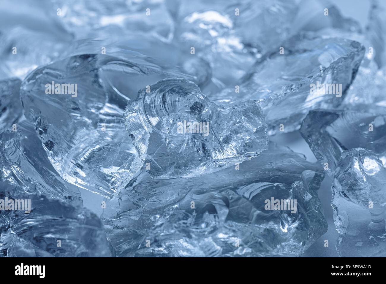 Close-up of Transparent Ice Blocks with Intricate Patterns in Cool Blue Tones Stock Photo