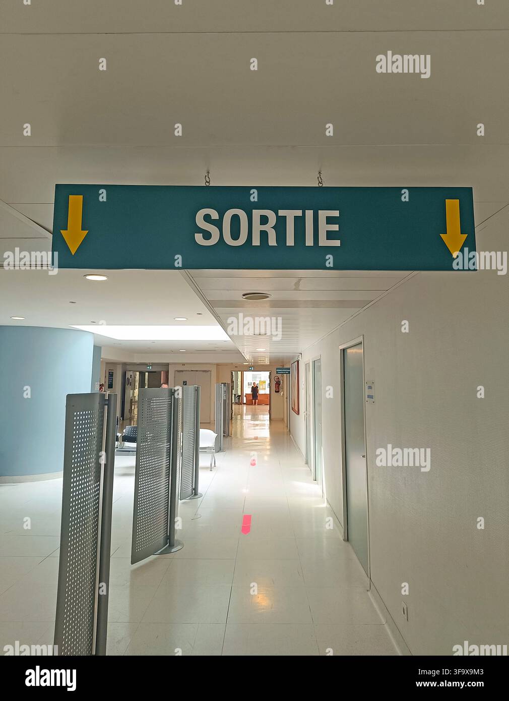 Hospital corridor with exit sign Stock Photo