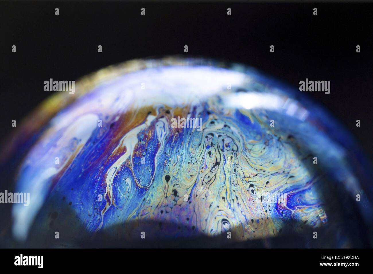 Abstract pattern, multicolored chaotic texture inside of the soap bubble, closeup. High quality FullHD footage Stock Photo