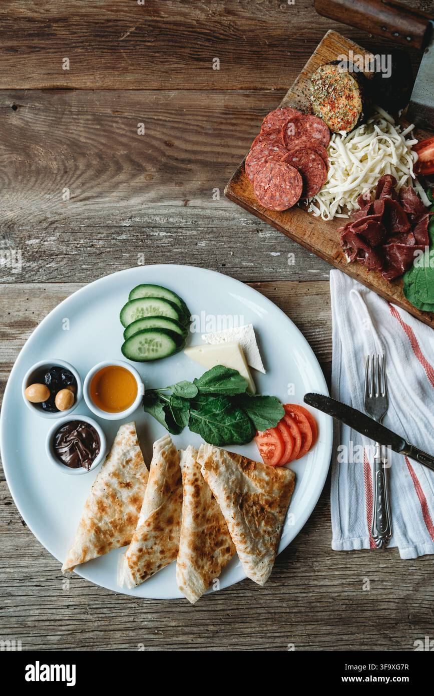 Full Turkish breakfast spread on a rustic table Stock Photo