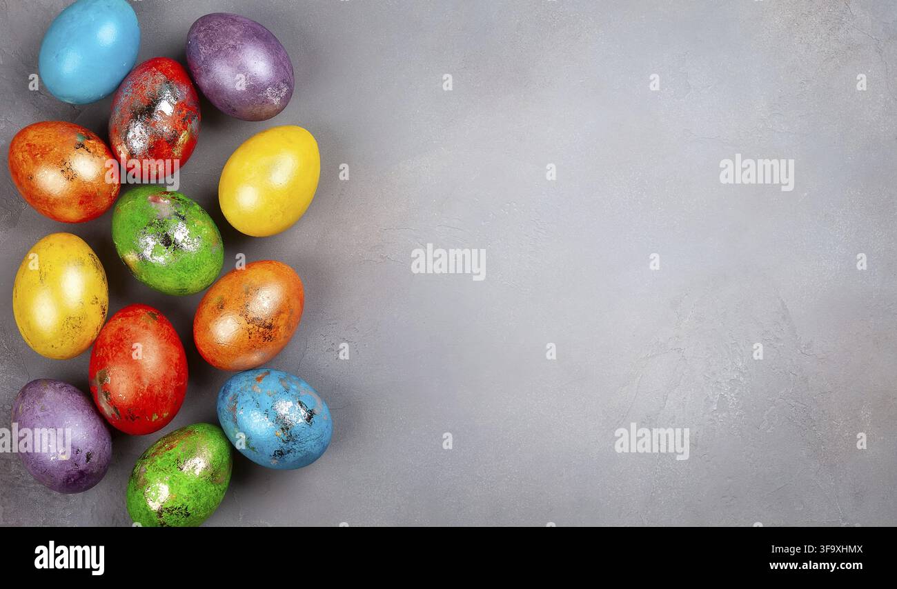 Easter concept wit colorful Easter eggs on grey background. Top view with copy space Stock Photo