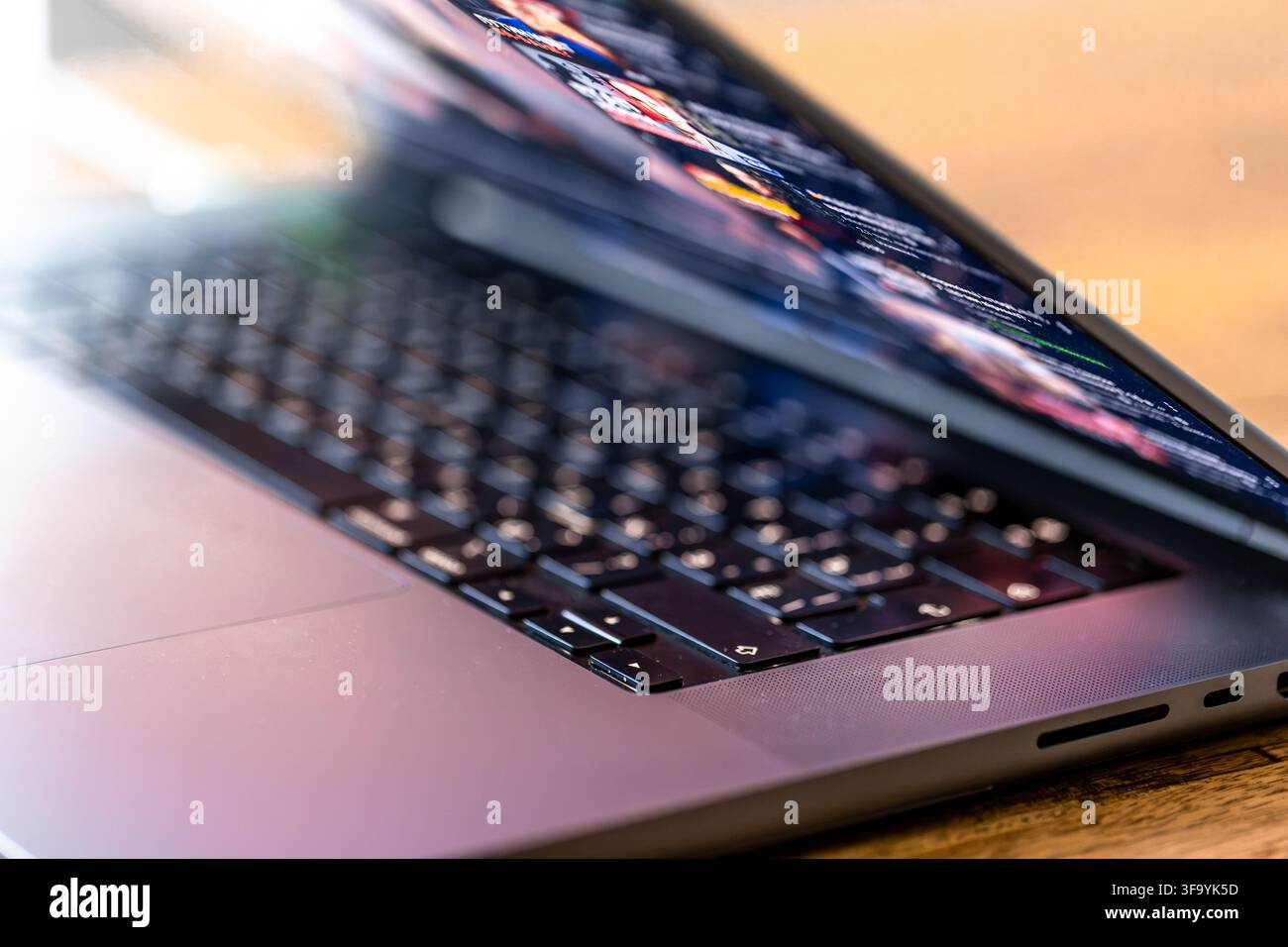 Laptop keyboard and blurred digital screen. Technology workspace closeup. Stock Photo