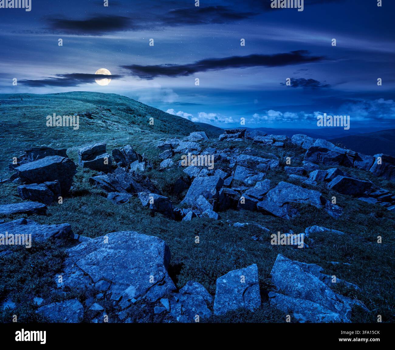 carpathian mountain landscape on summer night. mysterious background for outdoor adventure in the dark. transcarpathia green hill with rocks in foll m Stock Photo