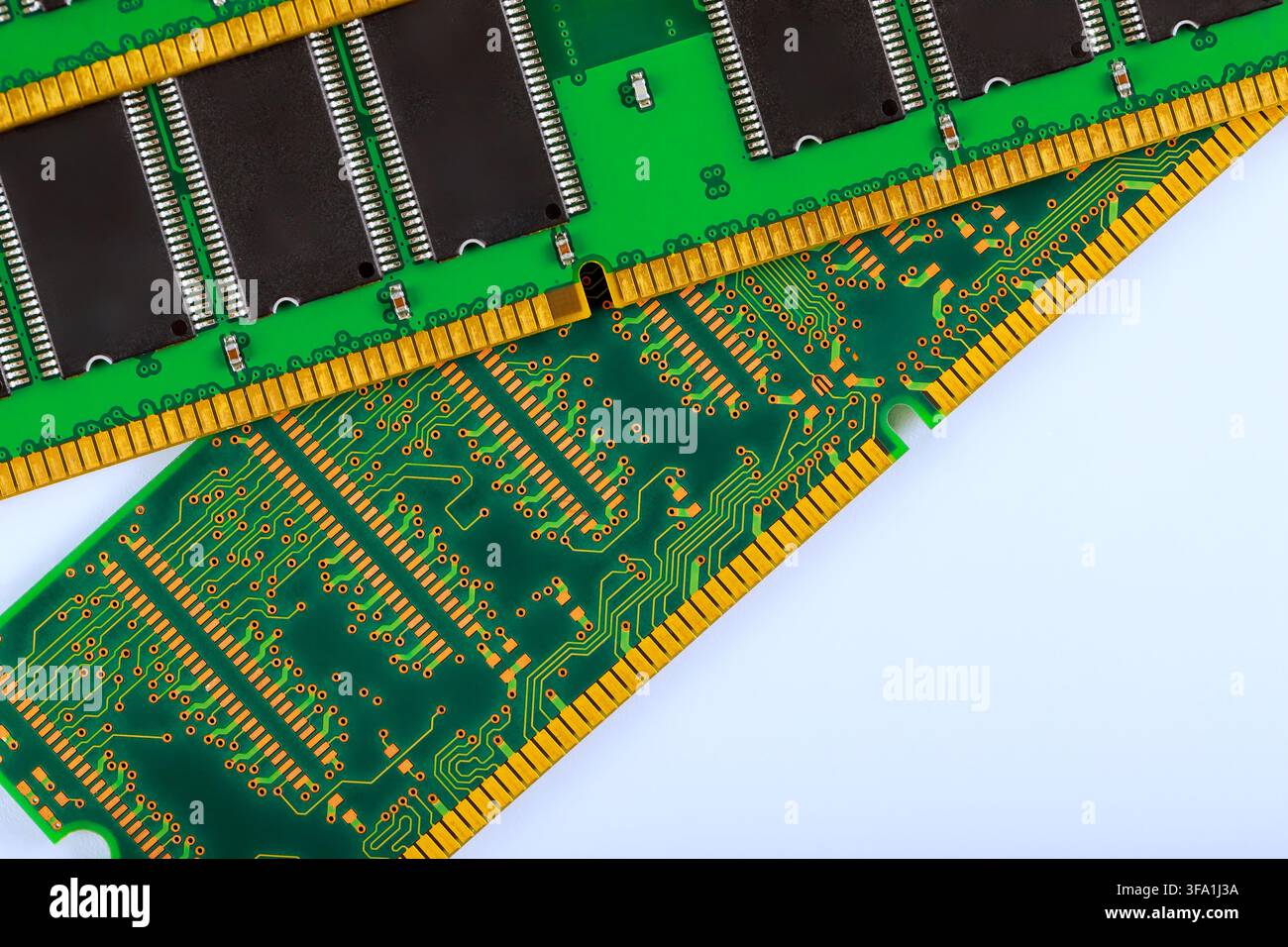 Computer memory modules are placed with intricate gold connectors, representing modern computer hardware Stock Photo