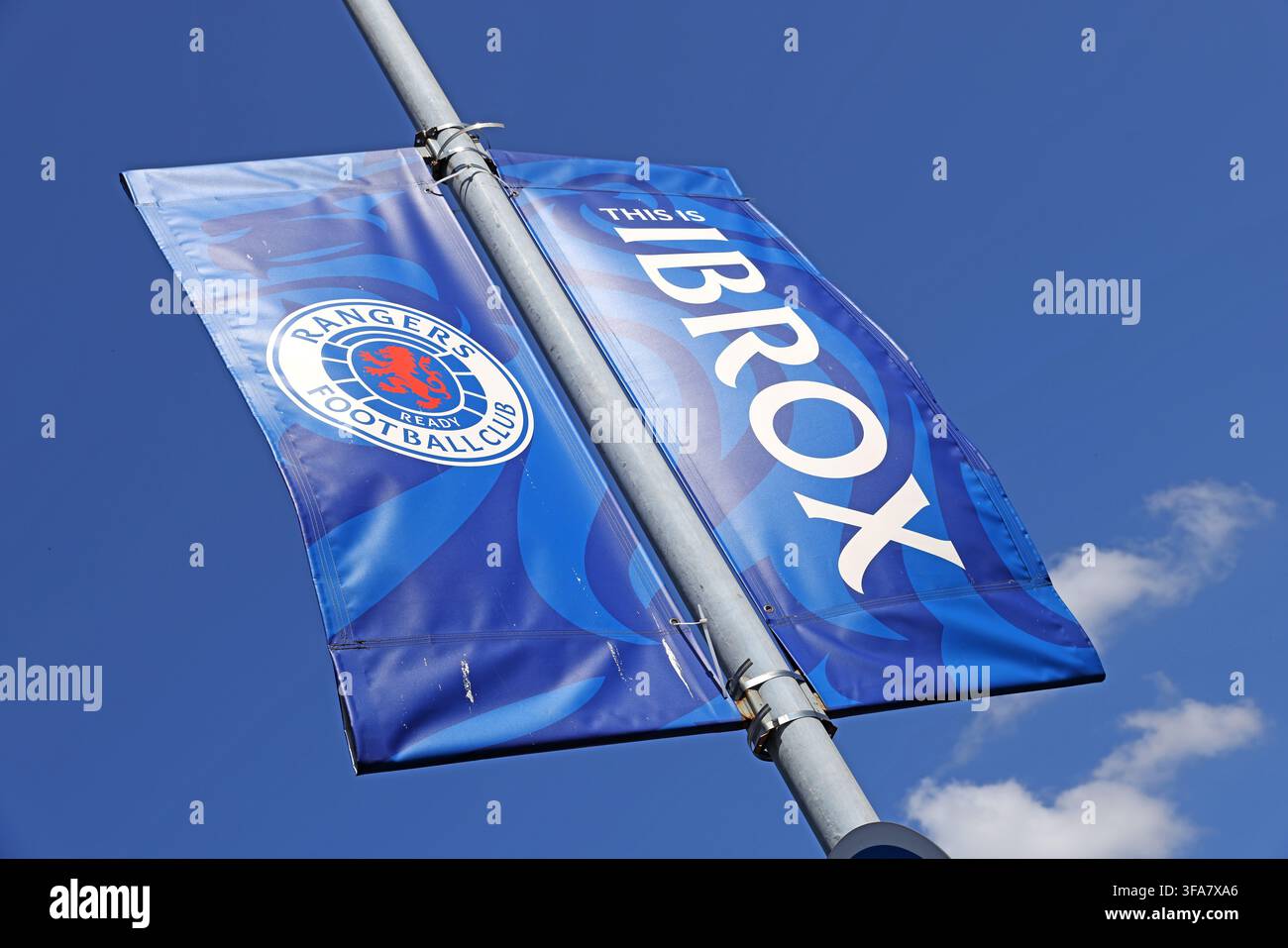 Rangers FC flag flying beside Ibrox Stadium in Glasgow Stock Photo