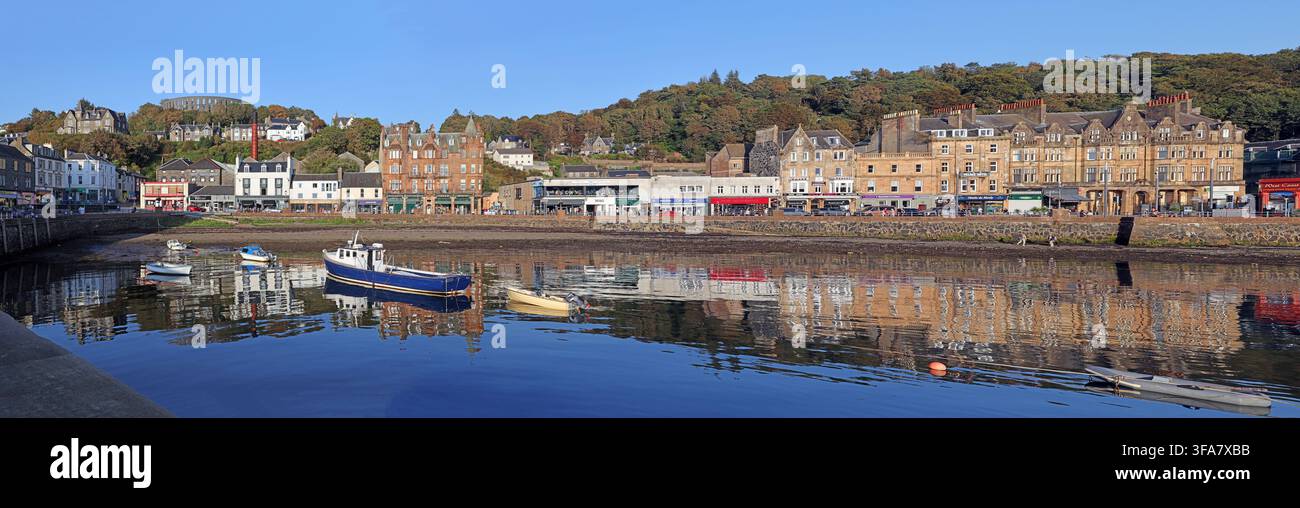 Panoramic view of Oban harbour waterfront with Oban Distillery chimney Stock Photo