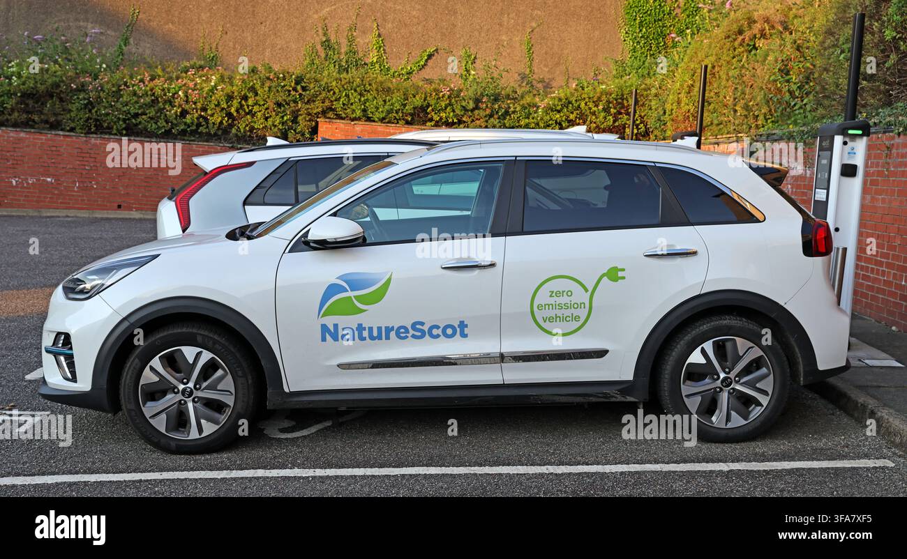 NatureScot electric car using an EV charging point in Oban, Scotland Stock Photo