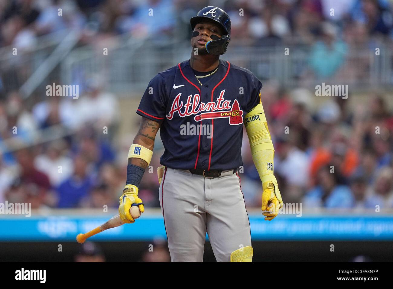 Atlanta Braves' Ronald Acuña Jr. walks back to the dugout after ...
