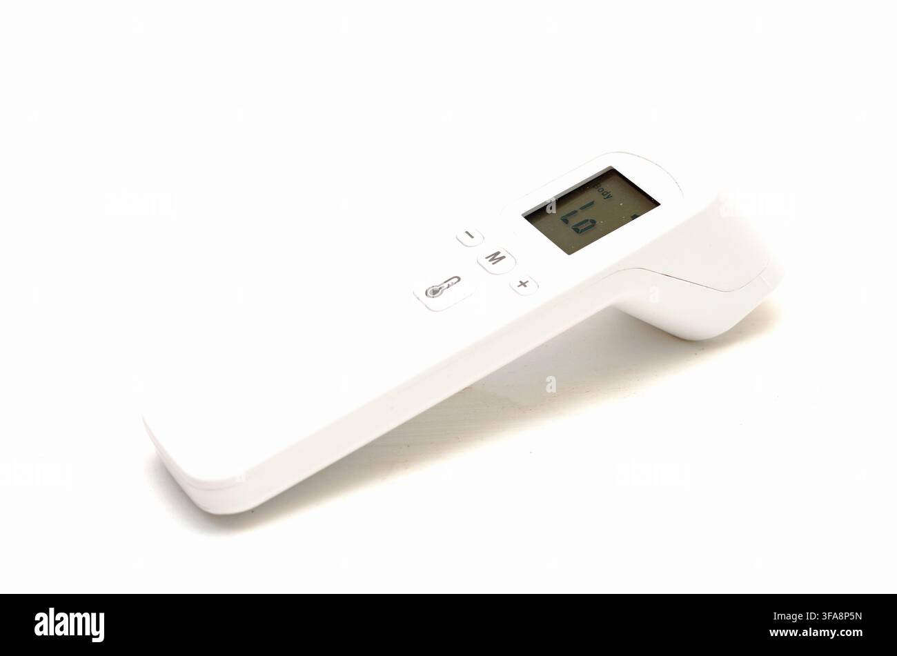 Digital infrared forehead thermometer measuring temperature isolated on white background. Stock Photo