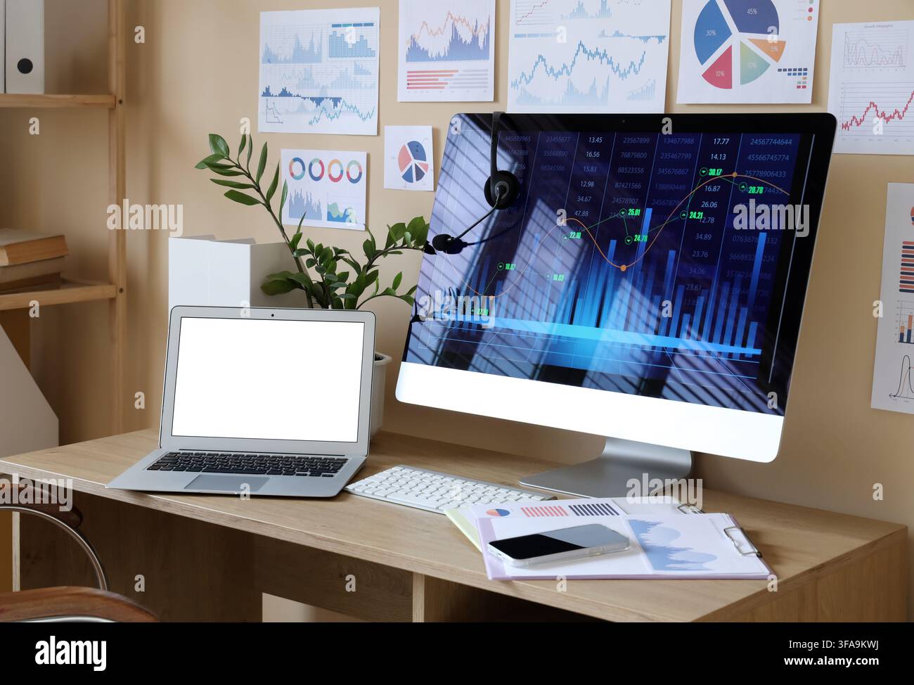 Data scientists workplace with diagrams in office Stock Photo