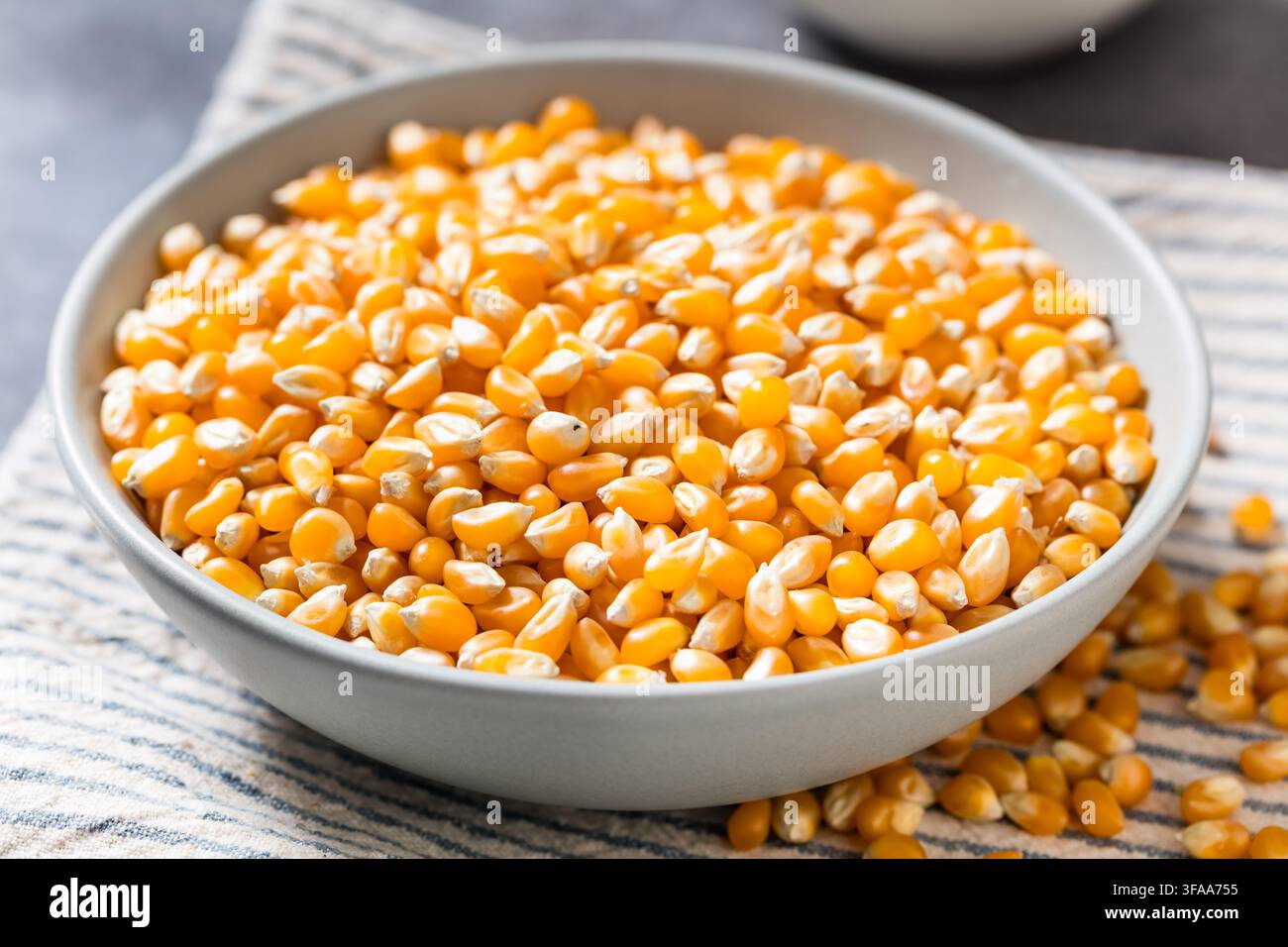 Dry Organic Raw Pop Corn Kernels in a Bowl Stock Photo