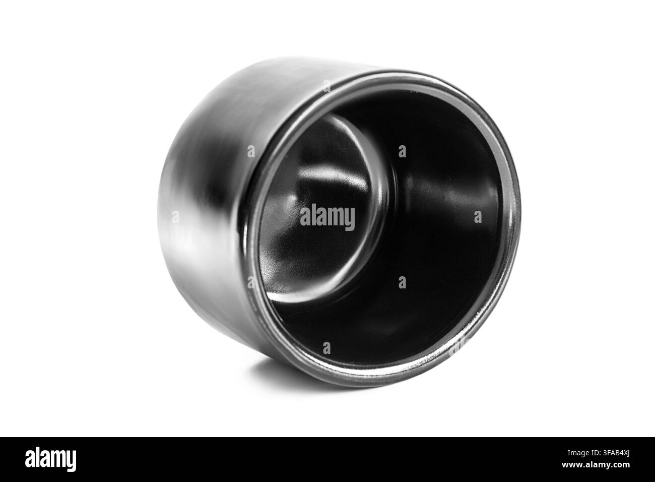 Empty black ceramic sauce bowl lying on white background Stock Photo