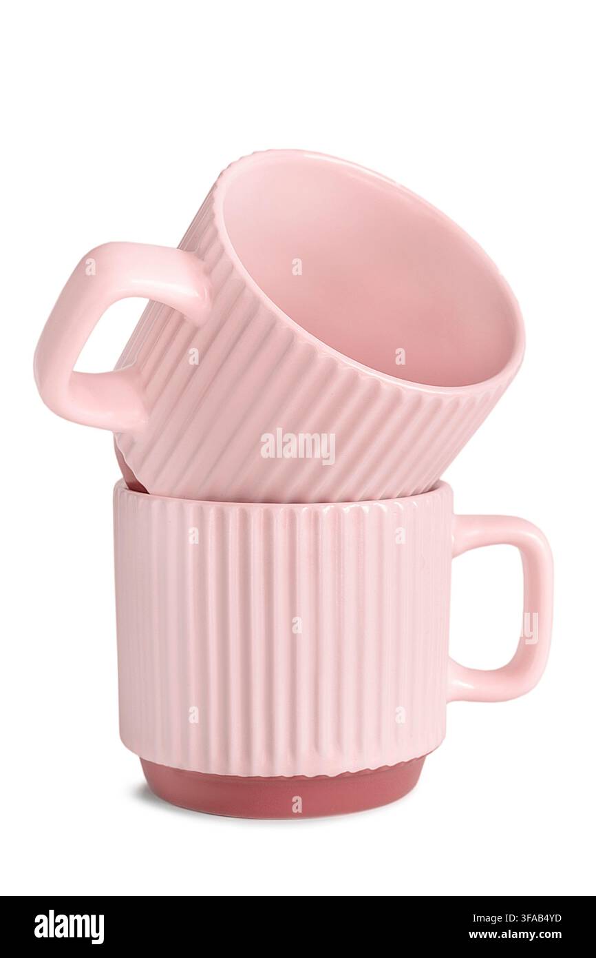 Two pink ceramic empty coffee cups isolated on white background Stock Photo