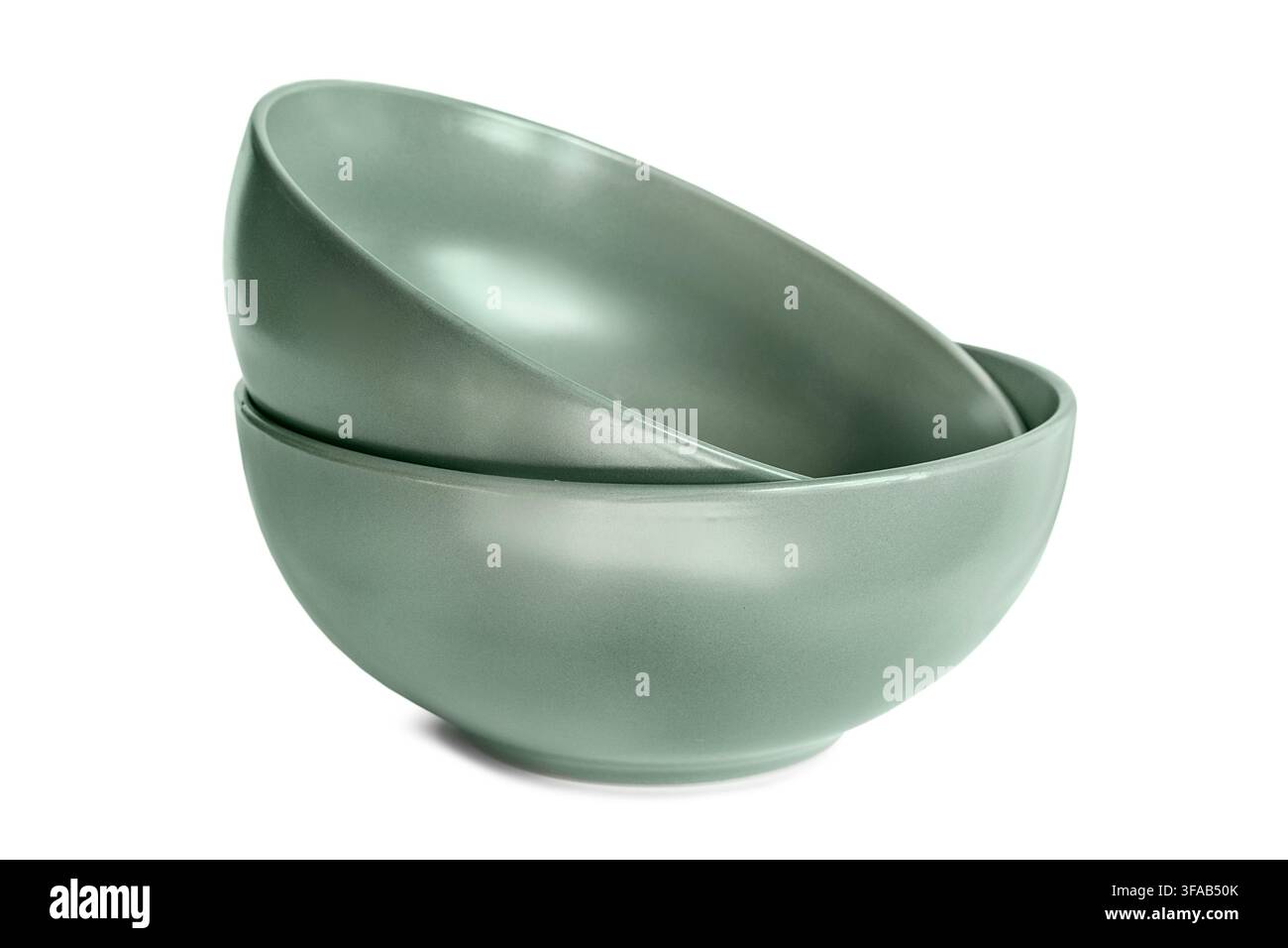 Two green ceramic empty bowls isolated on white background Stock Photo
