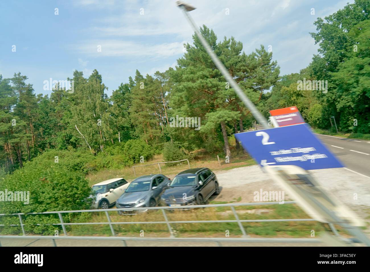 Soft tourism and recreational mobility along rural roads in Brandenburg during August, captured from a moving vehicle with visible motion blur emphasi Stock Photo