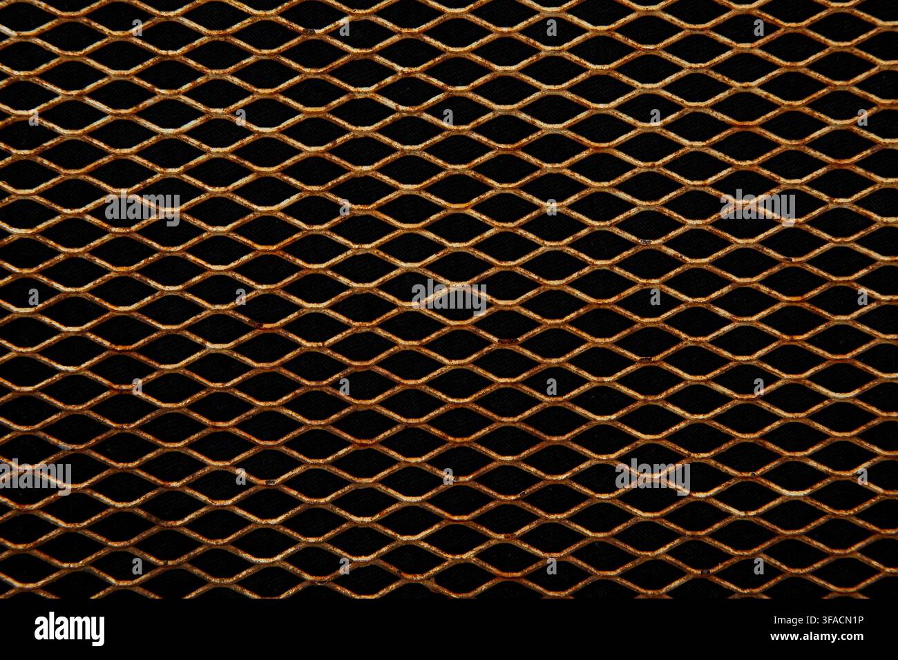 Rusty metallic diamond mesh grid background full frame texture. Stock Photo