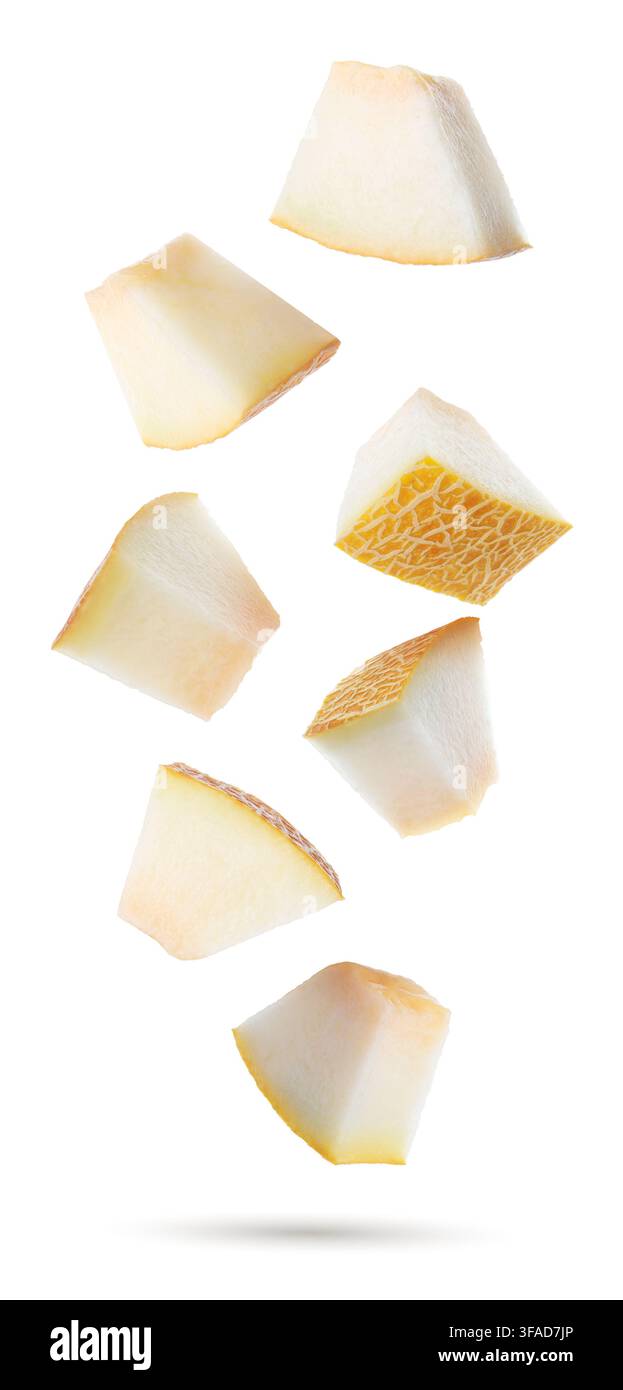 Fresh melon. Pieces flying in air on white background Stock Photo