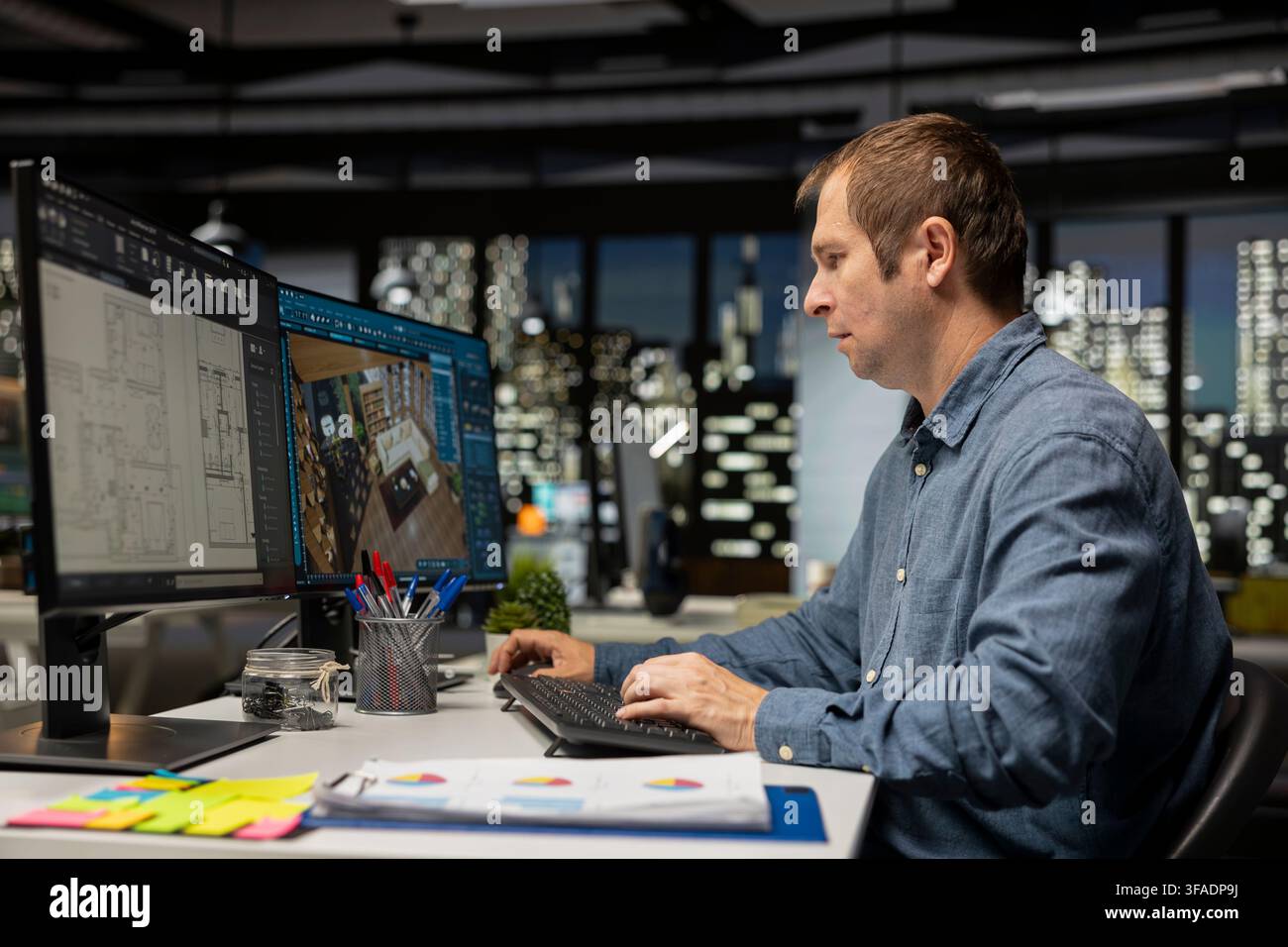 Expert designer decorating apartment floor plan using blueprints on pc, using architectural software to configure elements. Focused man uses interface to enable rendering and 3D modeling. Stock Photo