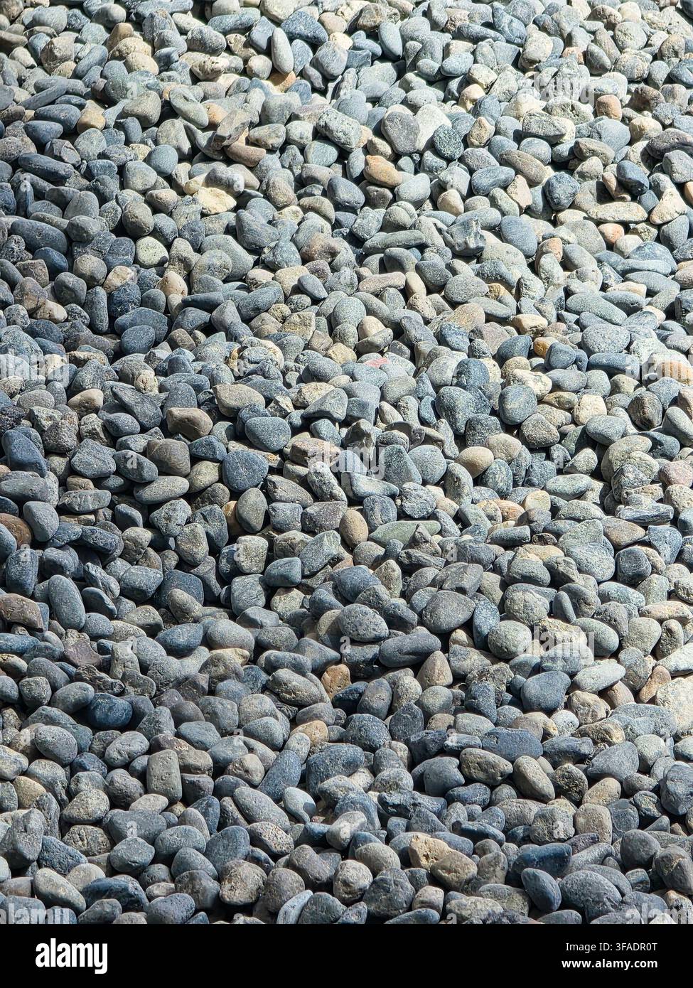 Natural Gray and Multicolored Pebble Stone Texture Background Stock Photo