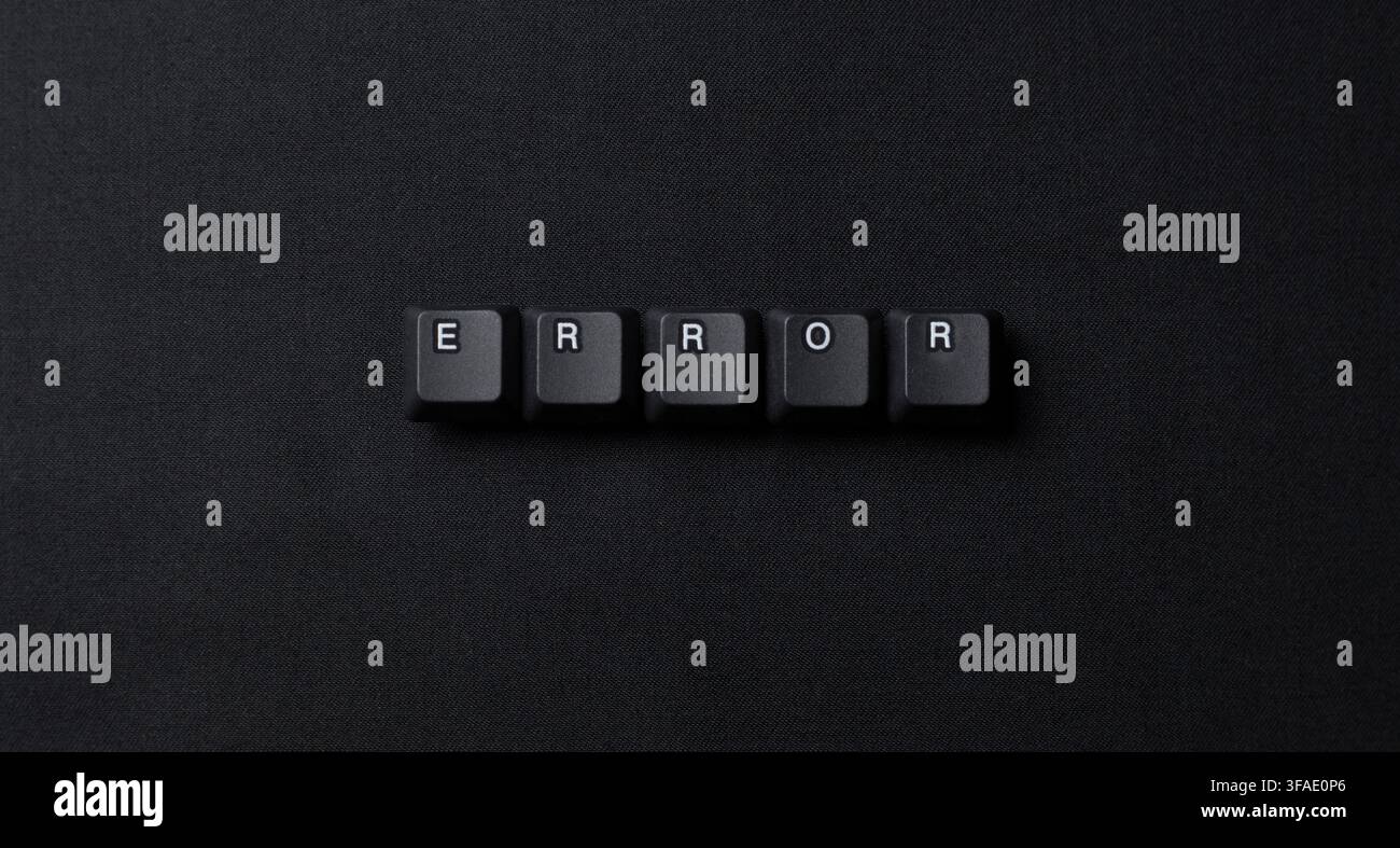 Error word made from keyboard keys on a dark textured surface, representing system failure, bug, troubleshooting, crash, and technology problems. Stock Photo