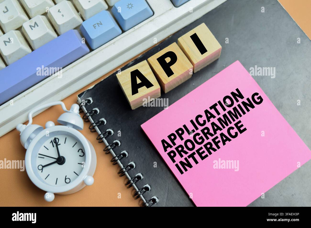 Concept of API - Application Programming Interface write on sticky notes isolated on table. Stock Photo