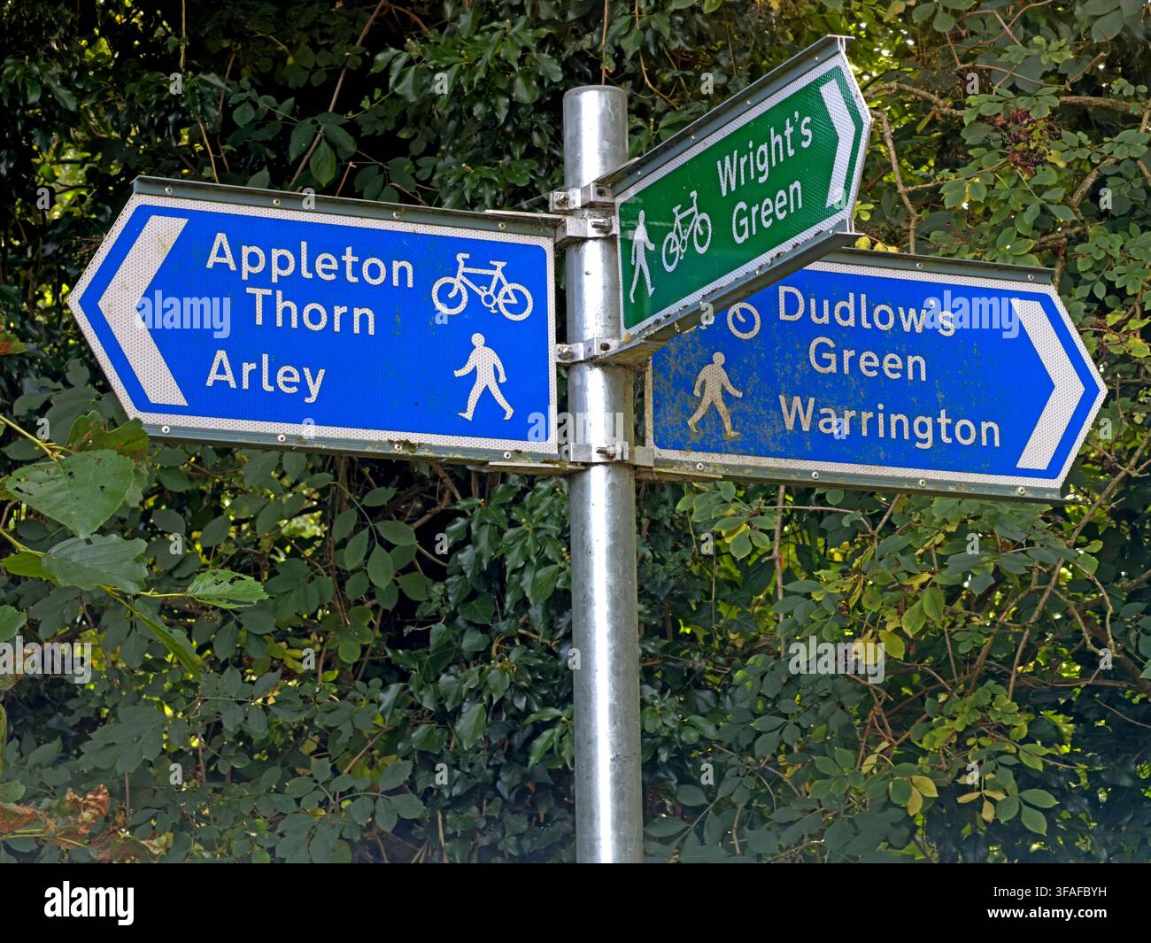Walking and cycling direction sign at Appleton Thorn for Arley, Wright's Green and Dudlow's Green, promoting local active travel routes. Stock Photo